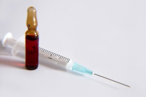 medical syringe and ampoule on a white background.